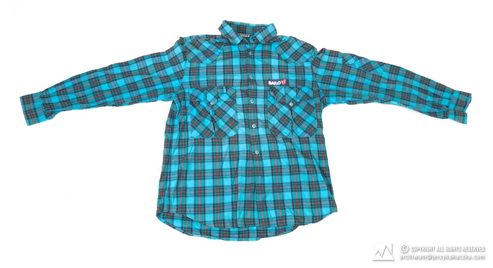 Koszula firmy Bailo. Niebieska w fioletowo-zielono-czerwoną kratę, z długim rękawem. Lata 70-80 XX w.