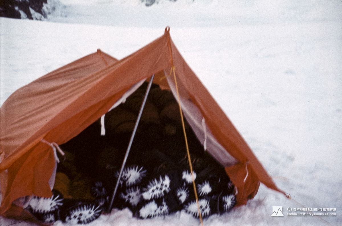 Participants of the expedition in a tent at the base camp.