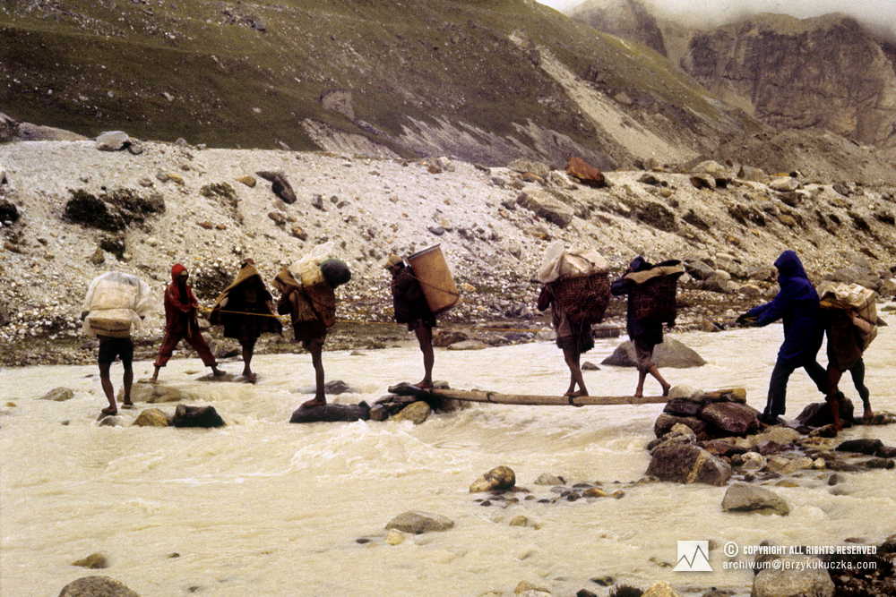 Participants of the expedition during the crossing of the river. Alex MacIntyre is second from right.
