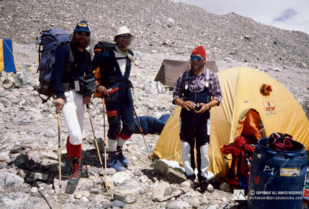 Jerzy Kukuczka (red cap) and members of another expedition - possibly Austrian or Hungarian - in the base camp.